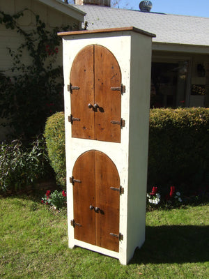The Abbey Arches Cabinet by Arcadian Cottage in Phoenix, Arizona. Made with reclaimed barn wood and painted with white milk paint. Makes for a unique handmade cabinet.